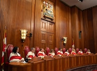 Supreme Court of Canada Justice Michelle O'Bonsawin(left),  Justice Nicholas Kasirer, Justice Malcolm Rowe, Justice Andromache Karakatsanis, Chief Justice Richard Wagner, Justice Suzanne Cote, Justice Sheilah Martin, Justice Mahmud Jamal and 
Justice Mary Moreau are seen during a welcome ceremony at the Supreme Court, in Ottawa, Monday, Feb. 19, 2024. THE CANADIAN PRESS/Adrian Wyld