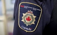 A Correctional Service of Canada patch is seen on the arm  of a corrections officer in Abbotsford, B.C., on Thursday October 26, 2017. The Correctional Service of Canada is confirming that the inmate who briefly escaped from a New Brunswick prison on the weekend was Jermaine Carvery, a career criminal known for terrorizing robbery victims and attempting to flee custody. THE CANADIAN PRESS/Darryl Dyck