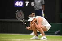 Ukraine's Elina Svitolina celebrates winning against Poland's Iga Swiatek during their women's singles quarter-finals tennis match on the ninth day of the 2023 Wimbledon Championships at The All England Tennis Club in Wimbledon, southwest London, on July 11, 2023. (Photo by Daniel LEAL / AFP) / RESTRICTED TO EDITORIAL USE (Photo by DANIEL LEAL/AFP via Getty Images)