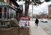 A sold sign is pictured on the lawn of a home, south of Bloor/Dovercourt in Toronto on February 12, 2024 (Laura Proctor/The Globe and Mail)