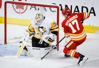 Pittsburgh Penguins goalie Tristan Jarry (35) lets in a goal from Calgary Flames forward Yegor Sharangovich (17) during second period NHL hockey action in Calgary, Saturday, March 2, 2024.THE CANADIAN PRESS/Jeff McIntosh