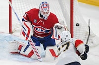 Florida Panthers' Eetu Luostarinen (27) takes a shot on Montreal Canadiens goaltender Sam Montembeault during first period NHL hockey action in Montreal, Tuesday, April 2, 2024. THE CANADIAN PRESS/Graham Hughes