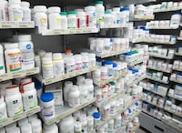 The federal health minister Jean-Yves Duclos says regulations governing medical practice may have to be strengthened in each province to prevent "incompetence" by more doctors who could write thousands of prescriptions for drugs headed out of the country. Prescription drugs are seen on shelves at a pharmacy in Montreal on March 11, 2021. THE CANADIAN PRESS/Ryan Remiorz