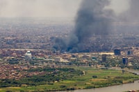 Smoke billows during fighting in the Sudanese capital Khartoum, on May 3, 2023. - Persistent fighting between Sudan's rival generals undermined efforts to firm up a truce, as a senior UN official arrived for talks on providing relief to millions of trapped civilians. (Photo by AFP) (Photo by -/AFP via Getty Images)