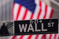 A street sign is seen in front of the New York Stock Exchange the New York Stock Exchange, Tuesday, Feb. 27, 2024, in New York. Stocks are holding relatively steady on Wall Street near their record levels.  (AP Photo/Frank Franklin II)
