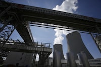 FILE - Equipment frames the cooling towers of the Temelin nuclear power plant near the town of Tyn nad Vltavou, Czech Republic, on Thursday, June 25, 2015. The U.S. and its European allies are importing vast amounts of nuclear fuel and compounds from Russia, providing Moscow with hundreds of millions of dollars in badly needed revenue as it wages war on Ukraine. (AP Photo/Petr David Josek, File)
