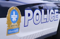 Montreal police say they're investigating after a fire was set at a bakery that has been targeted by criminals two other times times since May. The Montreal Police logo is seen on a police car in Montreal on Wednesday, July 8, 2020. THE CANADIAN PRESS/Paul Chiasson