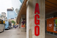 TORONTO, ONTARIO, CANADA - 2017/07/22: AGO (Art Gallery of Ontario)  sign in the building exterior. Tourists bus parked outside the cultural institution and everyday lifestyle in Toronto city. (Photo by Roberto Machado Noa/LightRocket via Getty Images)