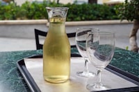 carafe of white wine and two glasses