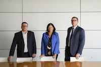   KPMG's Kevin Kolliniatis and Kristy Carscallen, pose for a photograph with Leyton Perris (far right), Chief Executive Officer and President of MindBridge, at KPMG offices in downtown Toronto, Thursday April 13, 2023. (Christopher Katsarov/The Globe and Mail)