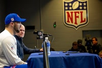 Buffalo Bills quarterback Josh Allen, far left, and coach, Sean McDermott, appear during a press conference at Highmark Stadium, in Orchard Park, N.Y., on Thursday, Jan. 5. 2023. Bills safety Damar Hamlin was awake, could move his hands and feet, and was able to write with a pen to ask who won the game between the Bills and Bengals where he had a cardiac arrest, his doctors said Thursday. (Brendan Bannon/The New York Times)