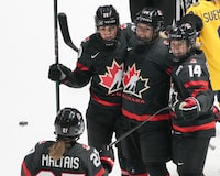 Canada's Natalie Spooner, centre, celebrates her goal over Sweden with teammates during third period quarter final hockey action at the IIHF Women's World Hockey Championship in Utica, N.Y., Thursday, April 11, 2024. THE CANADIAN PRESS/Christinne Muschi