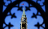 The federal government ended the 2022-23 fiscal year with a $41.3 billion deficit, slightly lower than it had forecast in its budget released in March. The Canada flag flies atop the Peace Tower on Parliament Hill in Ottawa on Friday, May 5, 2023. THE CANADIAN PRESS/Sean Kilpatrick