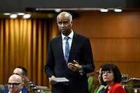 Minister of International Development Ahmed Hussen rises during Question Period in the House of Commons on Parliament Hill in Ottawa on Friday, March 22, 2024. THE CANADIAN PRESS/Justin Tang