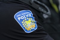 An increase in non-emergency calls to Peel Region's 911 service have prompted the police force to renew public education on when it's acceptable to call 911. A Peel Police shoulder patch is seen in Mississauga, Ont., on Saturday, July 1, 2023. THE CANADIAN PRESS/Arlyn McAdorey