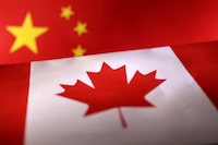 Printed Chinese and Canada flags are seen in this illustration, July 21, 2022. REUTERS/Dado Ruvic/Illustration REFILE - CORRECTING YEAR