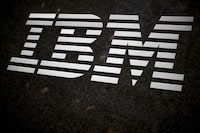 FILE - The IBM logo is displayed on the IBM building in Midtown Manhattan, April 26, 2017, in New York. IBM has agreed to sell assets of The Weather Company to private equity firm Francisco Partners for an undisclosed amount, the two companies announced Tuesday, Aug. 22, 2023. The acquisition will include Weather Channel mobile and the Weather.com — among other digital properties and enterprise offerings across industries and mediums, as well as The Weather Company's forecasting science and technology platform. (AP Photo/Mary Altaffer, File)