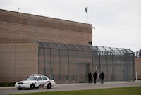 Officers walk in front of the Toronto South Detention Centre in Toronto on May 24, 2017.