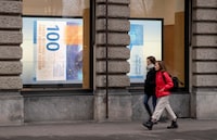A projection shows a 100 franc banknote in a window in Zurich, Switzerland December 16, 2021.