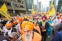 Sikhs march in a parade to mark Khalsa Day celebrations in Toronto, Ontario, Canada on April 28, 2024. (Photo by Geoff Robins / AFP) (Photo by GEOFF ROBINS/AFP via Getty Images)