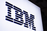 BARCELONA, SPAIN - FEBRUARY 28: A logo sits illuminated outside the IBM booth at the SK telecom booth on day 1 of the GSMA Mobile World Congress on February 28, 2022 in Barcelona, Spain. The annual Mobile World Congress hosts some of the world's largest communications companies, with many unveiling their latest phones and wearables gadgets like foldable screens.  (Photo by David Ramos/Getty Images)