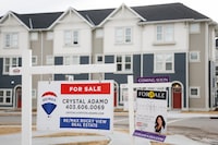 Houses for sale are shown in a new subdivision in Airdrie, Alta., Friday, Jan. 28, 2022. The Calgary Real Estate Board says rising interest rates had little impact on last month's home sales, which reached a record level for July. THE CANADIAN PRESS/Jeff McIntosh