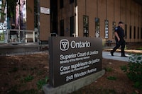 A Windsor police officer is seen outside Superior Court on day one of the Nathaniel Veltman trial in Windsor, Ont., Tuesday, Sept.5, 2023. The trial of a man facing terror-related murder charges in the deaths of four members of a Muslim family in London, Ont., in 2021 has started in Windsor. THE CANADIAN PRESS/Dax Melmer
