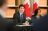 Canada's Prime Minister Justin Trudeau speaks at the National Summit on Combatting Auto Theft as President of the Treasury Board Anita Anand listens, in Ottawa, Ontario, Canada February 8, 2024.