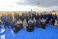 This handout photograph taken and released by NASA on September 27, 2023, shows International Space Station (ISS) crew (From L-Bottom) Expedition 69 NASA astronaut Frank Rubio, Roscosmos cosmonauts Sergey Prokopyev and Dmitri Petelin (sitting in chairs) outside the Soyuz MS-23 capsule after its' landing in a remote area near the town of Dzhezkazgan, Kazakhstan. The trio returned to Earth after logging 371 days in space as members of Expeditions 68-69 aboard the International Space Station. For Rubio, his mission is the longest single spaceflight by a US astronaut in history. (Photo by Bill INGALLS / NASA / AFP) / RESTRICTED TO EDITORIAL USE - MANDATORY CREDIT "AFP PHOTO / NASA/Bill Ingalls " - NO MARKETING NO ADVERTISING CAMPAIGNS - DISTRIBUTED AS A SERVICE TO CLIENTS (Photo by BILL INGALLS/NASA/AFP via Getty Images)