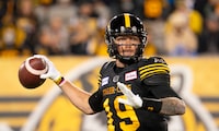 Hamilton Tiger-Cats quarterback Bo Levi Mitchell (19) gets set to throw against the B.C. Lions during first half CFL football game action in Hamilton, Ont. on Friday, October 13, 2023. THE CANADIAN PRESS/Peter Power