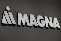 FILE PHOTO: Magna logo is during Munich Auto Show, IAA Mobility 2021 in Munich, Germany, September 8, 2021. REUTERS/Wolfgang Rattay/File Photo/File Photo