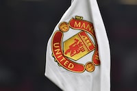 A corner flag showing the logo of Manchester United is seen ahead of the English FA Cup 4th round soccer match between Manchester United and Reading at Old Trafford in Manchester, England, Saturday, Jan. 28, 2023. (AP Photo/Rui Vieira)