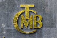 FILE PHOTO: A logo of Turkey's Central Bank is pictured at the entrance of its headquarters in Ankara, Turkey October 15, 2021. REUTERS/Cagla Gurdogan/File Photo