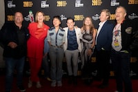 Former MuchMusic VJs Bill Welychka, left to right, Denise Donlon, Sook-Yin Lee, Rick Campanelli, Erica Ehm, Steve Anthony and Former MuchMusic program manager David Kines pose for a photograph on the red carpet for the documentary "299 Queen Street West" in Toronto, on Friday, September 22, 2023. THE CANADIAN PRESS/Tijana Martin