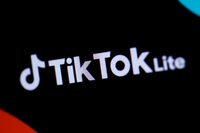 This photograph taken on April 11, 2024, in Paris, shows the logo of the Chinese social network application TikTok Lite. The social network TikTok, owned by the Chinese company ByteDance, has launched a new application in France and Spain, called TikTok Lite, which allows its users to get paid by watching videos, it announced on April 10, 2024. Users aged 18 or older can "collect points by discovering new content or completing certain actions," the social network said. (Photo by Kiran RIDLEY / AFP) (Photo by KIRAN RIDLEY/AFP via Getty Images)