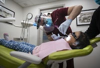 Dr. Hamza Jafri, a dentist in Rankin Inlet, Nunavut, takes care of five year old Piujulia Taylor’s teeth on Oct 20, 2022. Fred Lum/The Globe and Mail. 