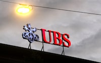 FILE PHOTO: The logo of Swiss bank UBS is seen at a branch office in Zurich, Switzerland, June 22, 2020. REUTERS/Arnd Wiegmann/File Photo