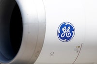 FILE PHOTO: A General Electric (GE) logo is seen on the engine of a Boeing 777-9 aircraft on display during the 54th International Paris Airshow at Le Bourget Airport near Paris, France, June 18, 2023. REUTERS/Benoit Tessier/File Photo