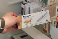 FILE PHOTO: A pharmacist displays a box of Ozempic, a semaglutide injection type 2 drug used for treating diabetes made by Novo Nordisk, at Rock Canyon Pharmacy in Provo, Utah, U.S. March 29, 2023. REUTERS/George Frey/File Photo
