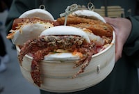 A "Holy Boa" of soft shell crab, pork belly, and deep fried pickles is shown at a food preview for the Calgary Stampede in Calgary on Wednesday, May 10, 2023. THE CANADIAN PRESS/Jeff McIntosh