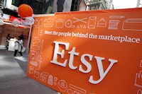 FILE PHOTO: A sign advertising the online seller Etsy Inc. is seen outside the Nasdaq market site in Times Square following Etsy's initial public offering (IPO) on the Nasdaq in New York April 16, 2015.   REUTERS/Mike Segar/File Photo/File Photo