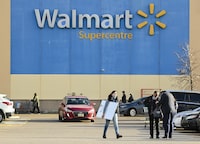 People leave the Walmart after shopping during the COVID-19 pandemic in Mississauga, Ont., Thursday, Nov. 26, 2020. THE CANADIAN PRESS/Nathan Denette