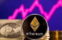 A representations of cryptocurrency Ethereum is seen in front of a stock graph and U.S. dollar in this illustration taken, Jan. 24, 2022.