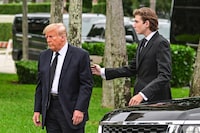 (FILES) Former US President Donald Trump and his son Barron Trump attend the funeral of former first lady Melania Trump's mother Amalija Knavs, at Bethesda by the Sea Church, in Palm Beach, Florida, on January 18, 2023. The US Republican Party has named Donald Trump's 18 year-old son Barron as a Florida delegate to its national convention, propelling another member of the family into the spotlight. (Photo by GIORGIO VIERA / AFP) (Photo by GIORGIO VIERA/AFP via Getty Images)
