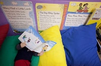 Monday, December 12, 2011, - Calgary, AB - Three-year-old, Brayden Viau reads a book at Acadia Learning Centre in Calgary, Alberta on Monday, December 12, 2011. The daycare which is owned by Edleun Group Inc. will spend millions to acquire seven Montessori daycares in the province, four as-yet undisclosed centres in Toronto and three in Windsor. It?æ?s the company?æ?s first foray into a province whose daycare sector is under increasing pressure ?æ? governments in major centres such as Toronto are suspiciously eyeing subsidized spaces because of budget crises, and the introduction of all-day kindergarten has thrown the financial plans of many small operators into disarray. Photo by Chris Bolin for the Globe and Mail. 
