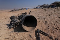 The remains of a rocket booster that, according to Israeli authorities critically injured a 7-year-old girl, after Iran launched drones and missiles towards Israel, near Arad, Israel, April 14, 2024. REUTERS/Christophe van der Perre
