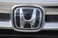 FILE - The Honda company logo is shown outside a Honda dealership Sunday, Sept. 12, 2021, in Highlands Ranch, Colo. Nissan and Honda agreed Friday, March 15, 2024 to work together on developing electric vehicles and auto intelligence technology. (AP Photo/David Zalubowski, File)