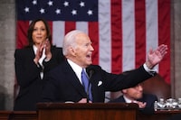 President Joe Biden delivers the State of the Union address to a joint session of Congress at the Capitol, Thursday, March 7, 2024, in Washington. Standing at left is Vice President Kamala Harris and seated at right is House Speaker Mike Johnson, R-La. (Shawn Thew/Pool via AP)