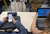 In this photograph taken on September 26, 2017, high school students use smartphones and tablet computers at the vocational school in Bischwiller, eastern France.   
Since the beginning of the school year in eastern France some 31,000 high school pupils have replaced their traditional textbooks by computers and tablets , a move popular with students but opinion is divided among teachers and parents. / AFP PHOTO / PATRICK HERTZOG        (Photo credit should read PATRICK HERTZOG/AFP via Getty Images)