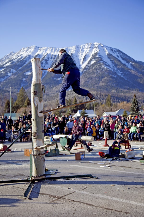 Lumberjack Show at Griz Days Winter Festival, Fernie, British Columbia, c. 2015 -- The Griz Days Winter Festival is held each winter since 1978, the festival celebrates the community's connection to winter and the legendary mountain man, the Griz - a hero in these parts - who with the help of his musket helps coax snow from the sky, gracing the region with an astounding annual snowfall averaging more than 29 feet annually. Credit: Tourism Fernie
